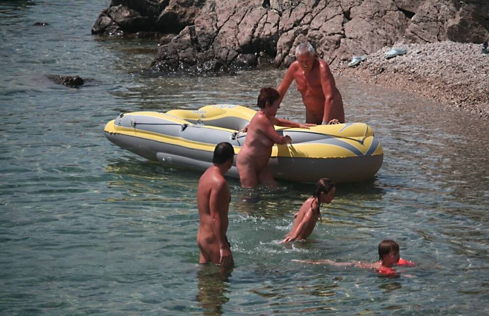 Lone Nudist in Yellow Boat photos - nudism blog