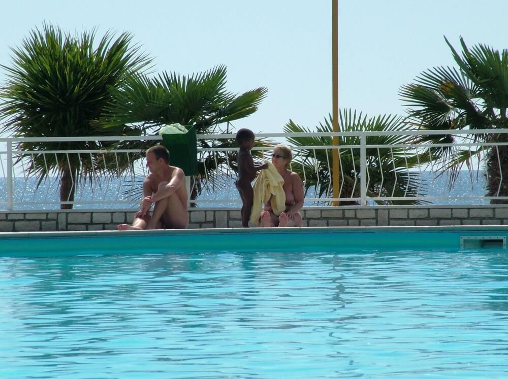 Photo of naturists in an outdoor pool - nudism blog